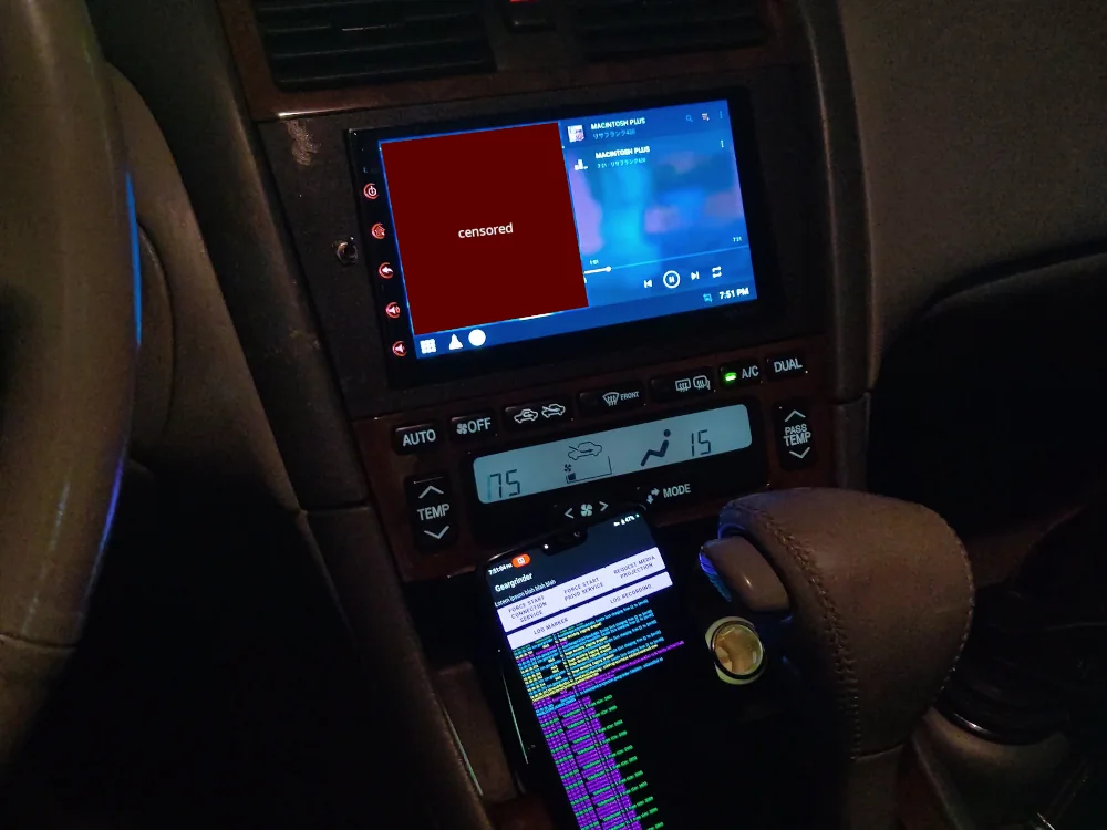 Picture of Geargrinder with a censored map and some music playing in split-screen on my car headunit.